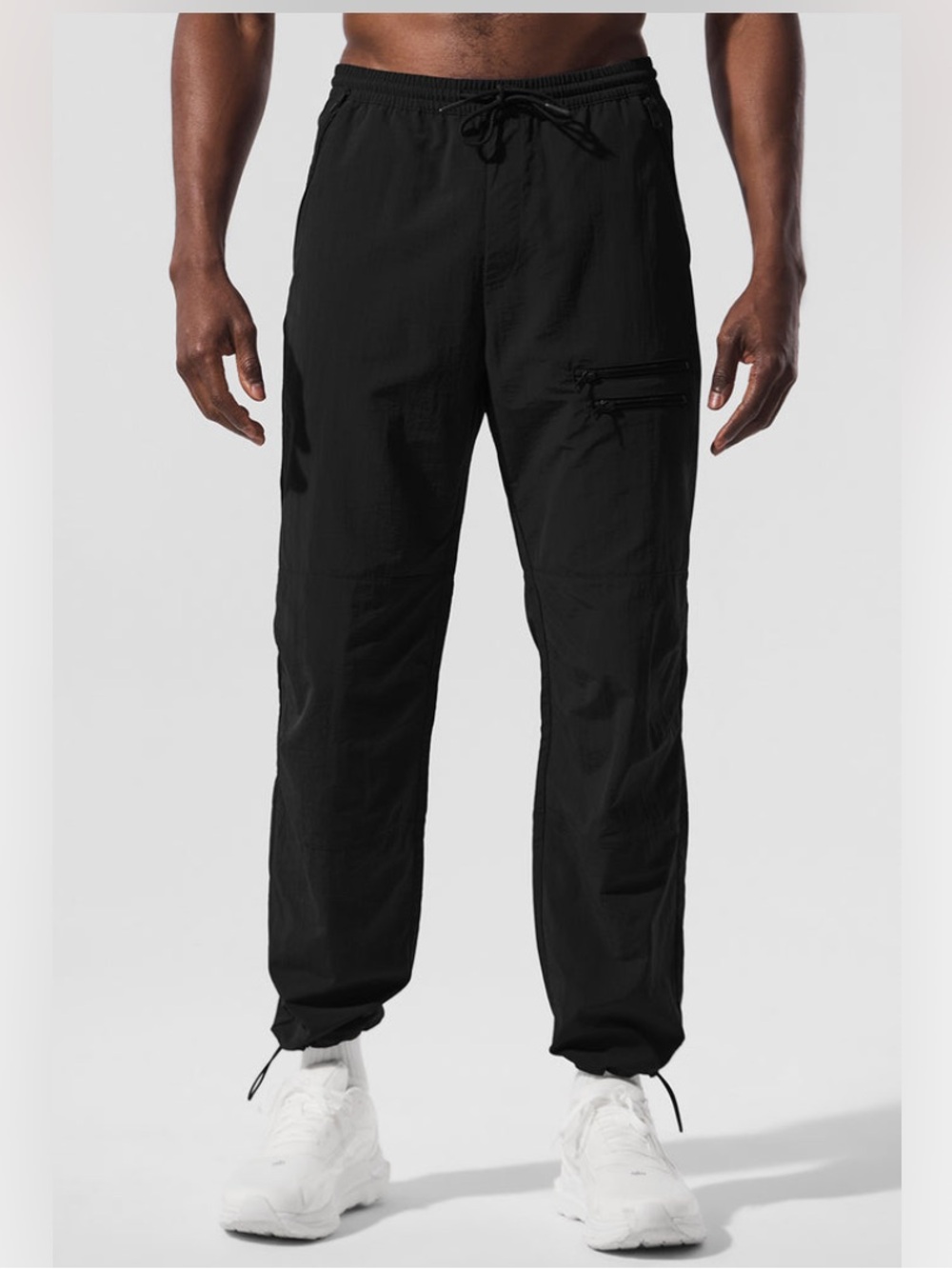 Alo Yoga Men’s Takeaway Track Straight Leg Pants in Black.